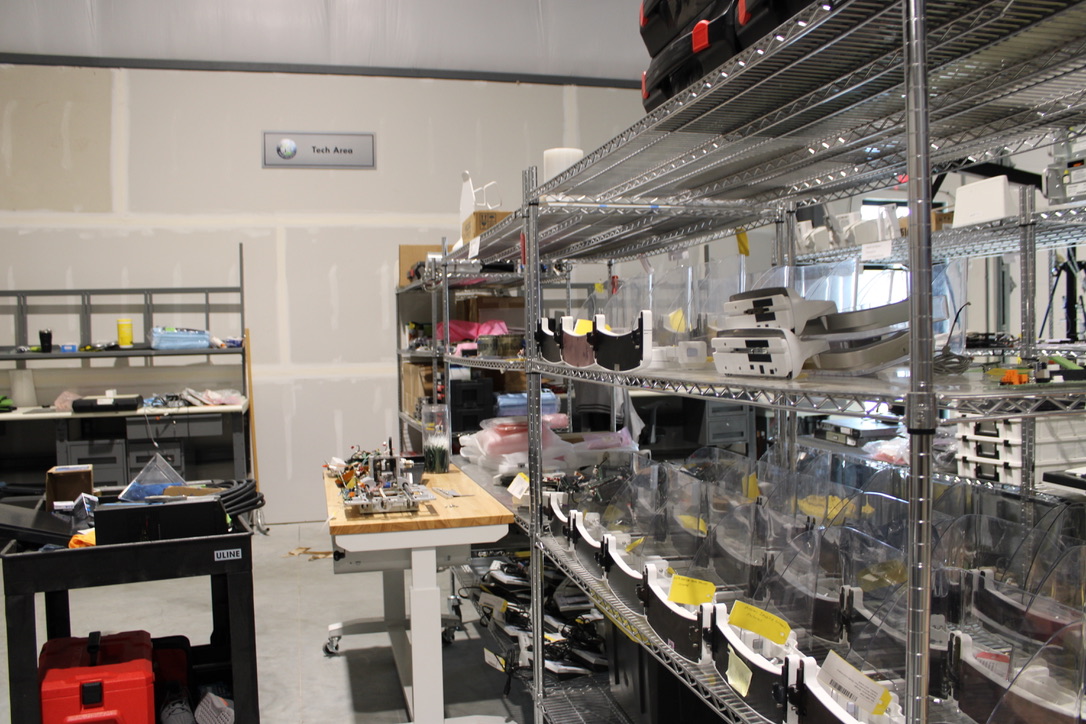 radiology equipment parts storage area with organized imaging system components on shelves