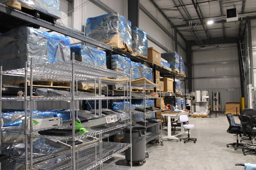 medical imaging parts warehouse with radiology equipment components stored on shelves