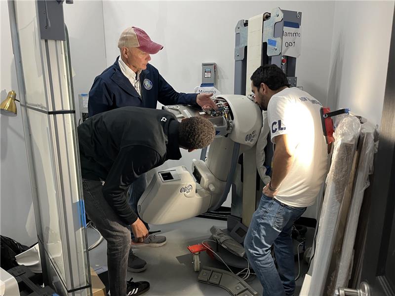 Request a Quote for radiology equipment installation as technicians assemble and position imaging system for clinical use